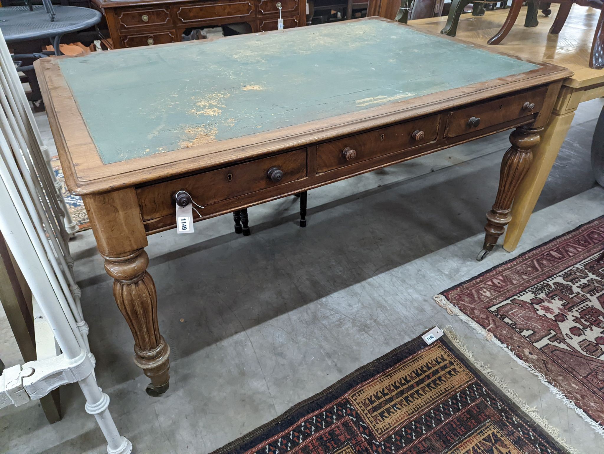 A Victorian mahogany partners writing table, width 150cm, depth 104cm, height 79cm